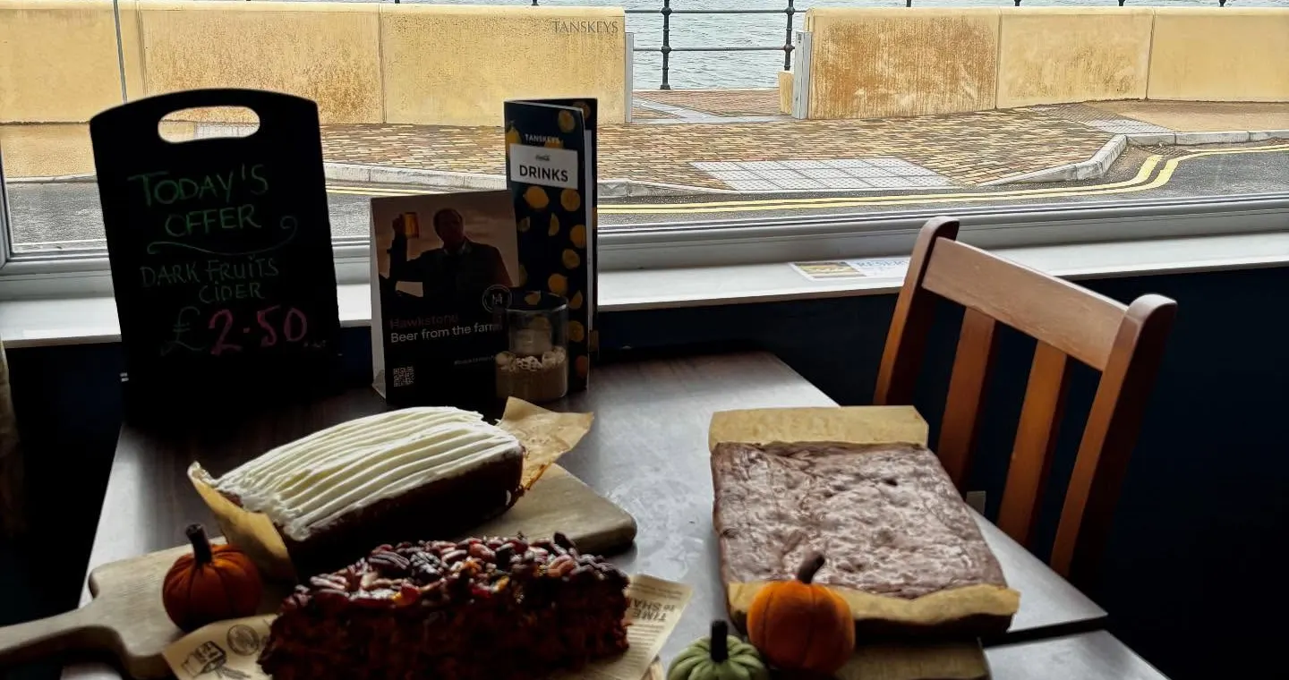 Cake and coffee beside the waterfront at Tanskeys