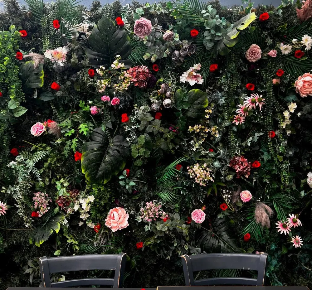 The flower wall used for events and photographs at Tanskeys